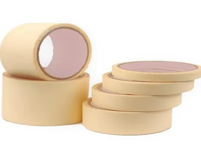 Cream masking tape rolls in different widths, stacked