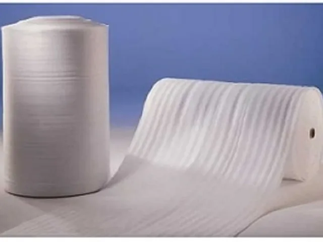 White PE foam sheet rolls, one partly unrolled, for cushioning and surface protection
