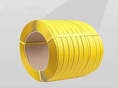 Yellow PP strapping coil on a cardboard core, 15 mm